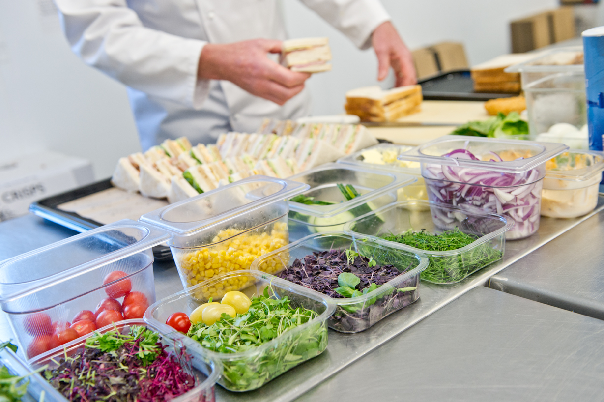 Sandwich platter being prepared with ingredients on display