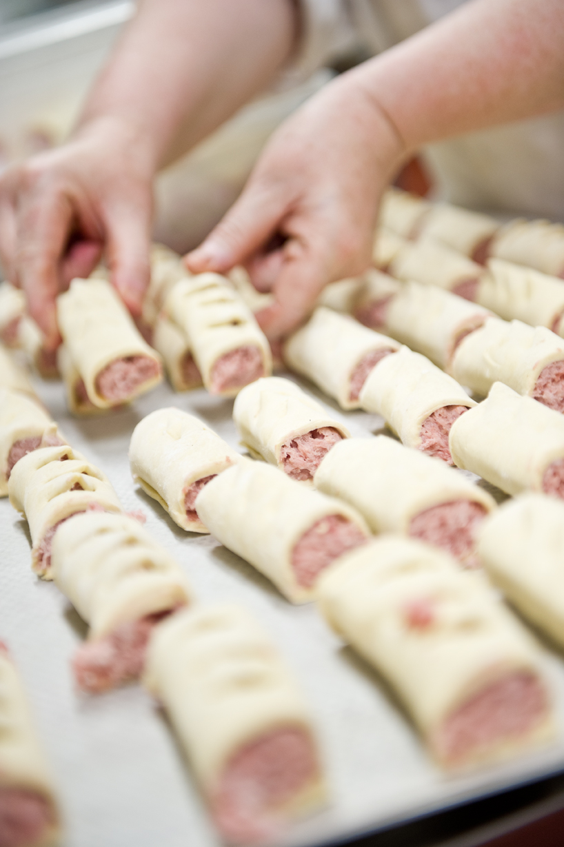 Sausage rolls ready to be cooked for corporate event