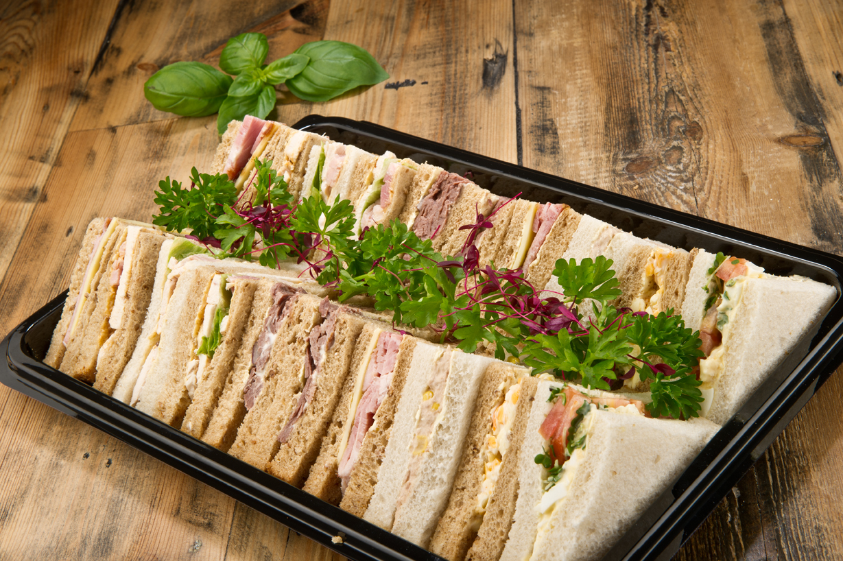 Platter of assorted sandwiches ready for delivery