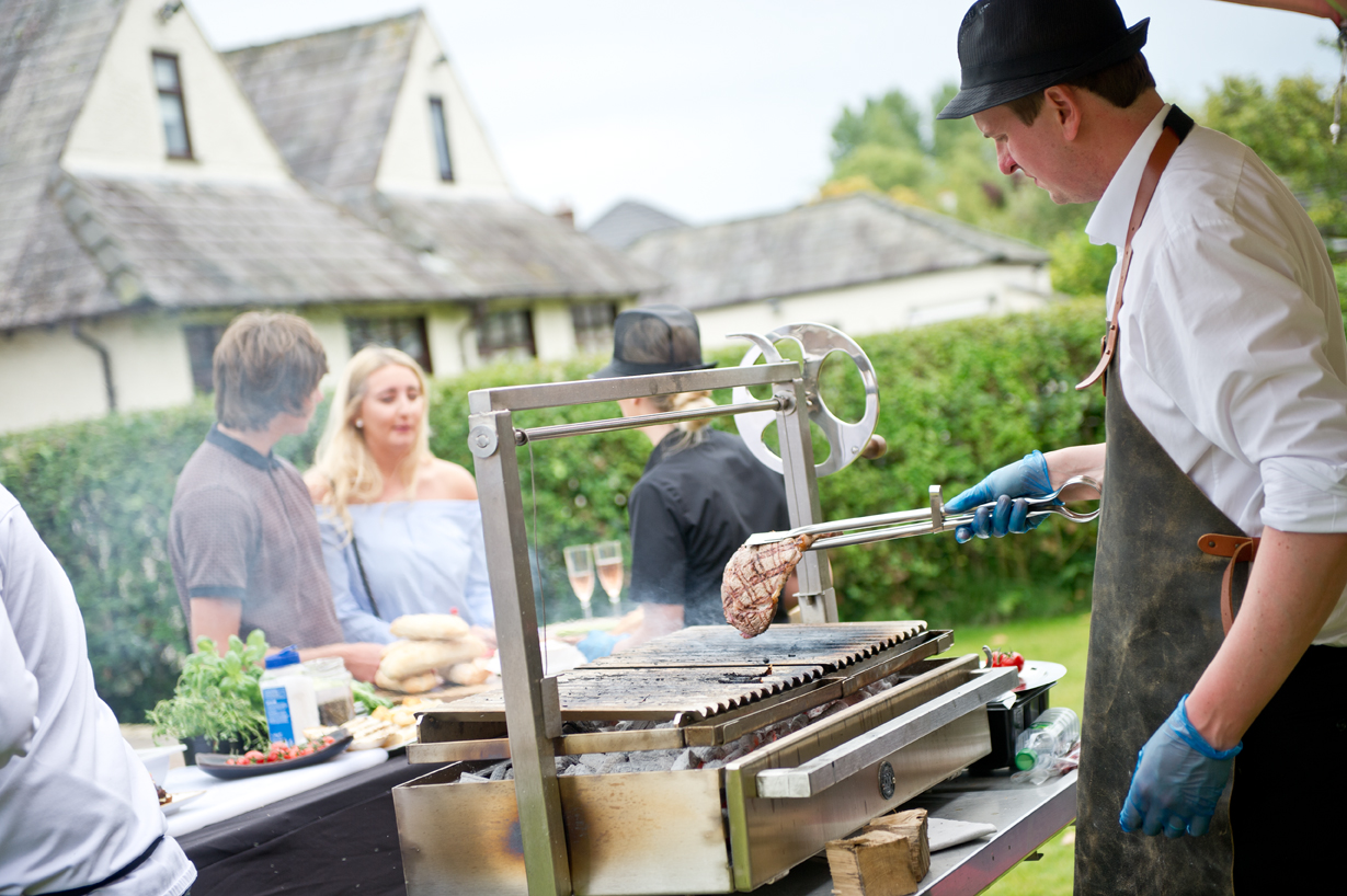 Steak being grilled at an outdoor bbq